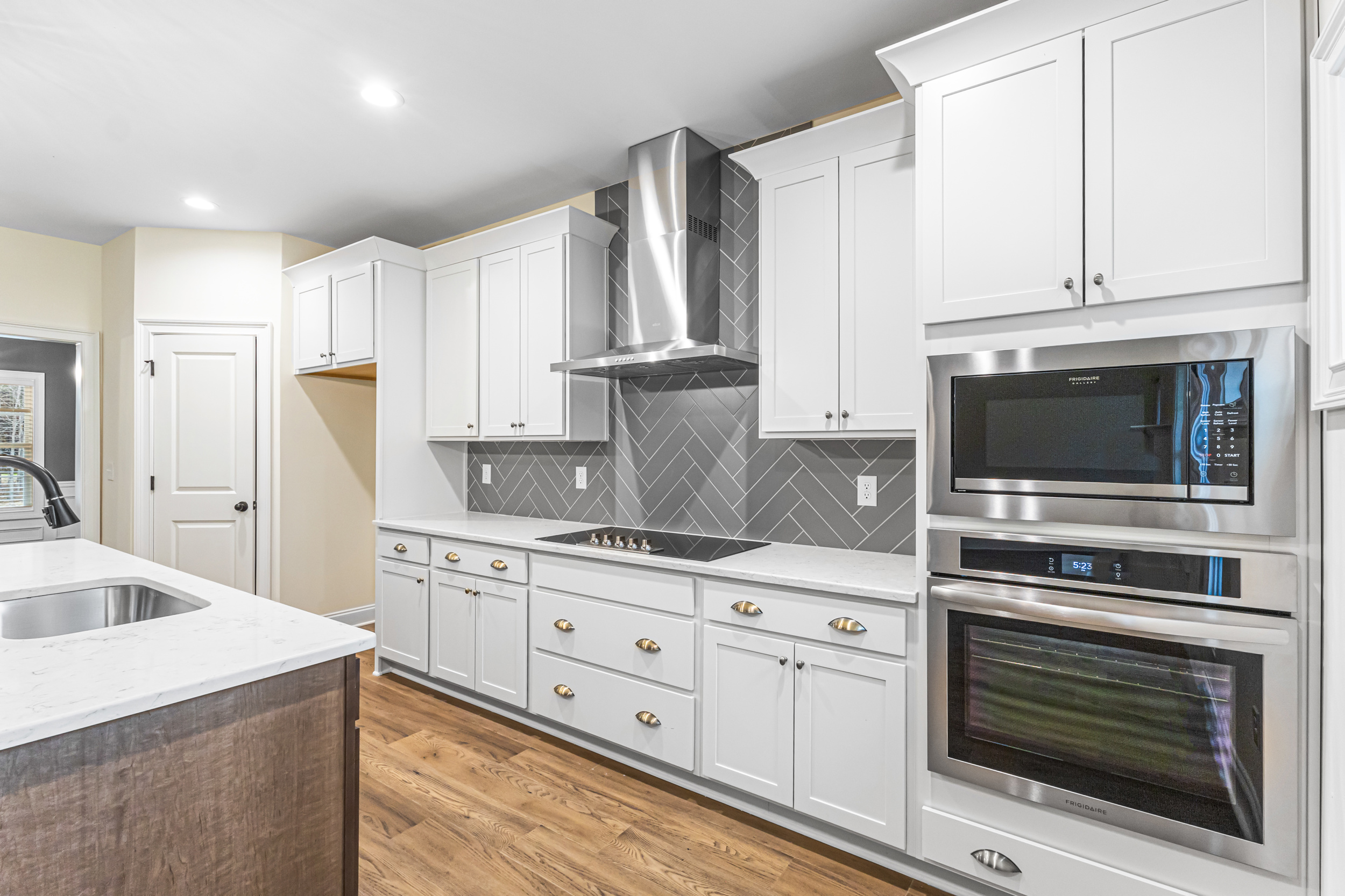 Move-in ready Hughston kitchen with granite countertops and stainless steel appliances