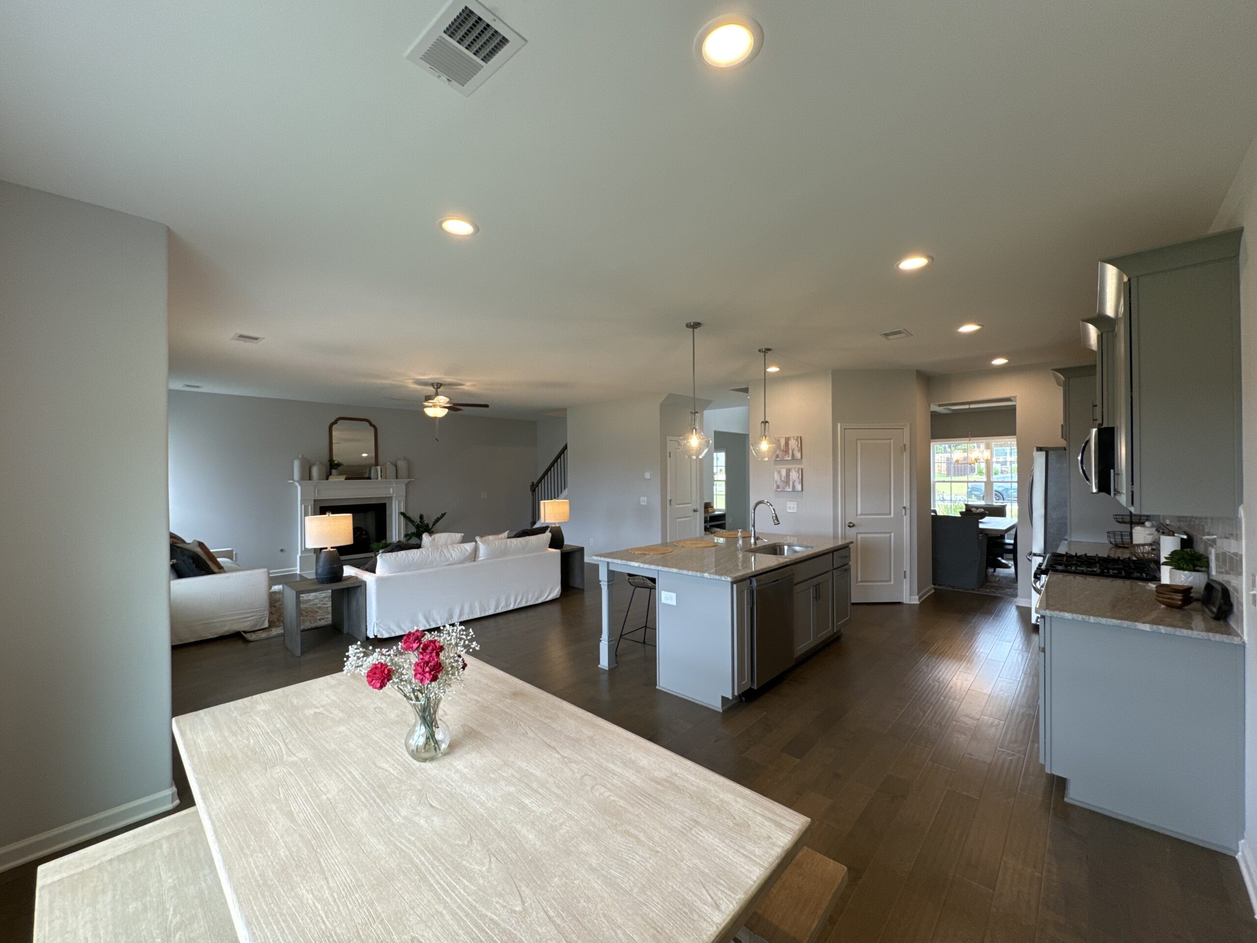 Finished Hughston move-in home interior with completed kitchen and living room